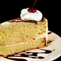 Cheese Cake · Slice of New York cheesecake and whipped cream.