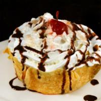 Fried Ice Cream · Large vanilla ice cream scoop. Served in a crispy cinnamon sugar covered bowl and topped wit...