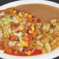 Chilaquiles · SCRAMBLED EGGS FRIED WITH PICO DE GALLO CORN TORTILLA CHIPS AND RANCHERO SAUCE TOPPED WITH M...