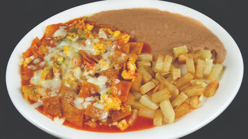 Chilaquiles · SCRAMBLED EGGS FRIED WITH PICO DE GALLO CORN TORTILLA CHIPS AND RANCHERO SAUCE TOPPED WITH MOZZARELLA CHEESE SERVED WITH BEANS AND DICED POTATOES
