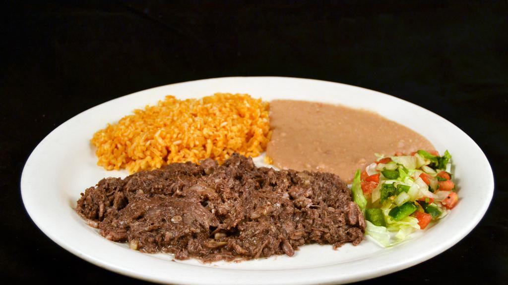 Plato De Barbacoa  · SHEREDDED BEEF CHEEK MEAT WITH PICO DE GALLO SERVED WITH RICE AND BEANS