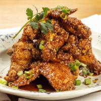 Sticky Chicken Wings · Crispy Chicken Wings, Soy & Ginger Glaze, Scallion and Sesame