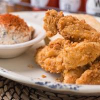 Love Me Tender · Four crispy tenders and one biscuit potato salad or cole slaw.