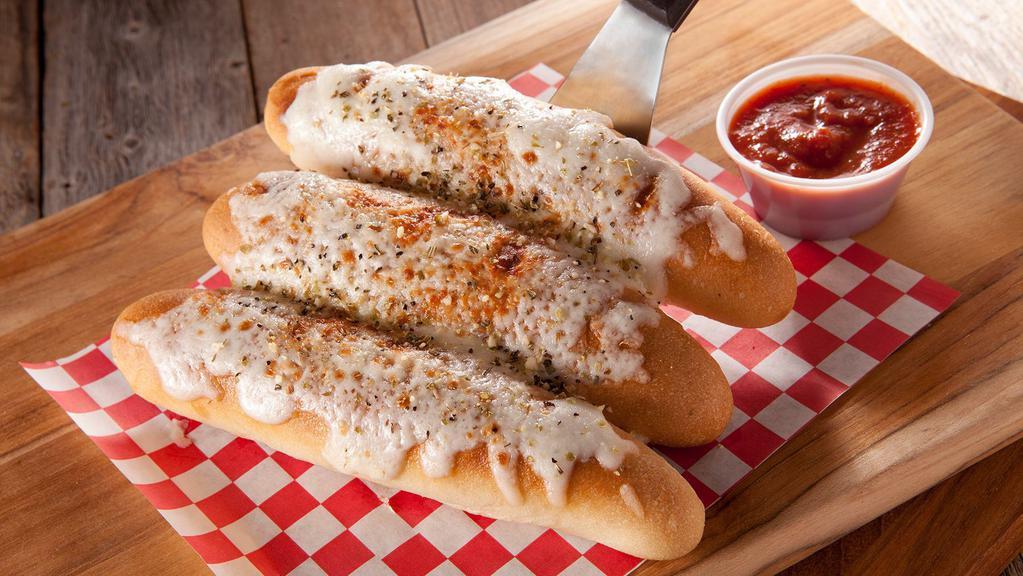 Cheesy Bread Sticks · It's Cheese That'll Make You Say Please! Our Cheesy Bread Sticks are topped with House Dredge, 100% Whole Milk Mozzarella Cheese, and a side of Marinara Sauce.