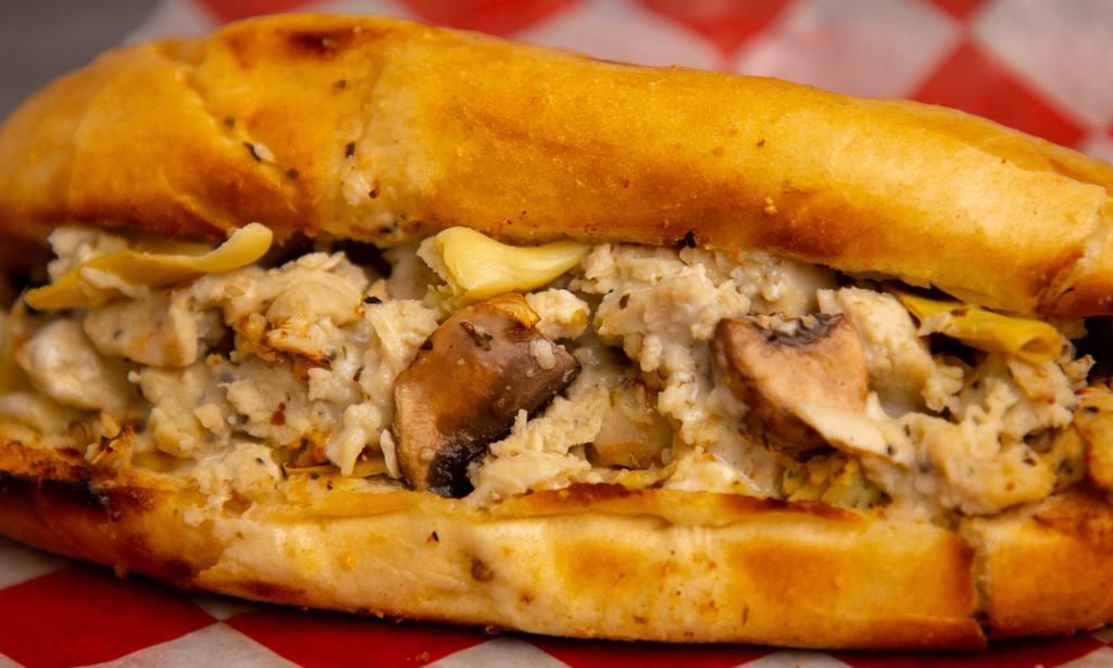 Chicken Lickin · Crooked Chicken just for the Lickin! Our Chicken Lickin Hoagie is served with Freshly Grated Parmesan Cheese, Freshly Sliced Mushrooms, Ken's Homestyle Ranch Dressing, Marinated Chicken, and Quartered Artichoke Hearts.