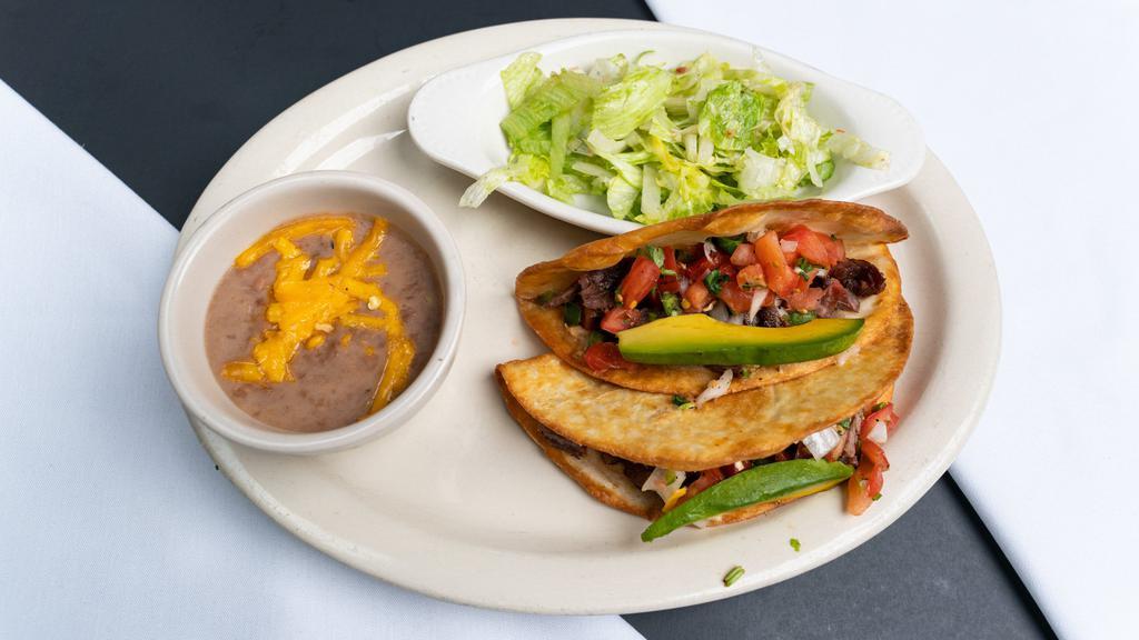 Desperadoes Tacos (Dinner) · Two crispy flour tortilla tacos, gooey melted jack cheese and your choice of beef or chicken fajita meat come together. topped with fresh pico de gallo and an avocado slice.