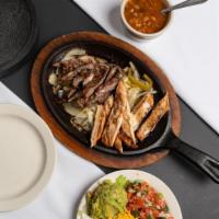 Chicken Fajita (Dinner) · Tender and juicy fajitas served sizzling along with bean soup, guacamole, cheddar cheese, so...