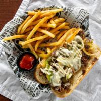Philly Cheese Steak · Thinly sliced steak grilled with onions and green bell peppers topped with mayonnaise and me...