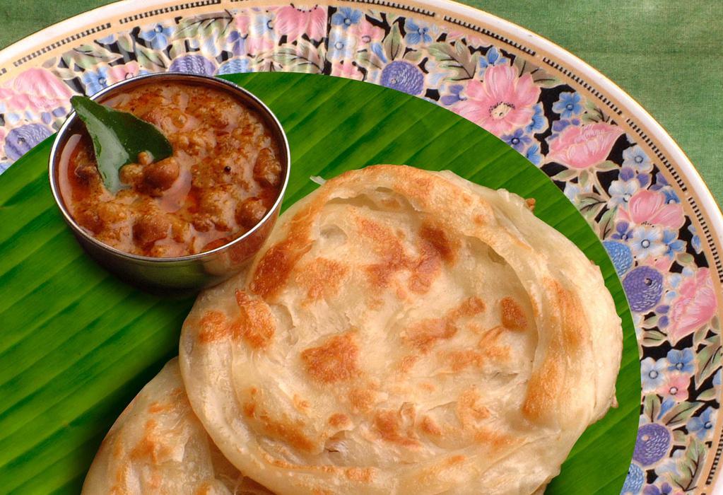 Parotta · Delicious South Indian fluffy bread served with vegetable curry and potato masala.