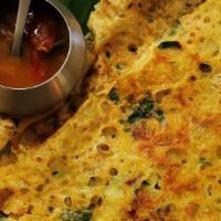 Ghee Onion Rava Dosa · Thin crispy crepe from semolina and rice sprinkled with ghee, mildly spiced, and garnished s...