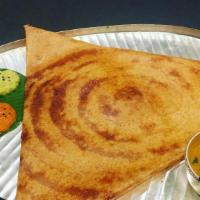 Onion Dosa · Thin rice and lentil crepe topped with onions. Served with three varieties of chutneys and s...