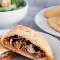Meat Calzone · Pizza sauce, pepperoni, sausage and Canadian bacon. Pizza sauce, pepperoni, sausage and Cana...