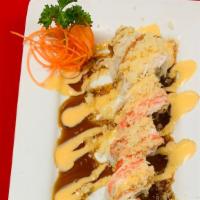 Shaggy Dog Roll · Shrimp tempura inside, topped with snow crab, crabstick, spicy mayo sauce, eel sauce and cru...