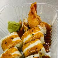 Houston Roll · Shrimp tempura, cream cheese and avocado with soy paper topped with eel sauce.