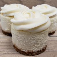 Traditional With Buttercream · A traditional cheesecake topped with vanilla buttercream and finished with a GF vanilla cook...