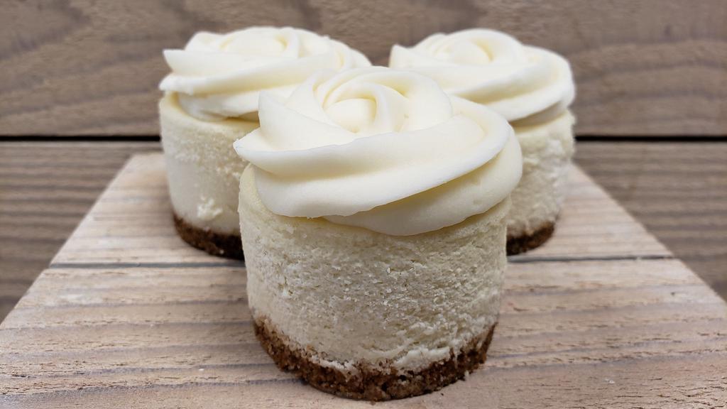 Traditional With Buttercream · A traditional cheesecake topped with vanilla buttercream and finished with a GF vanilla cookie crust