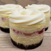 White Chocolate Raspberry · Rich white chocolate cheesecake swirled with our fresh house made raspberry fruit sauce, top...