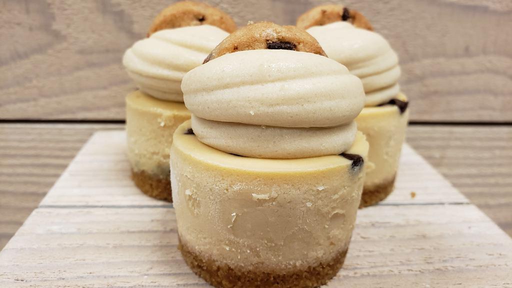 Ultimate Cookie Dough · Our cookie dough cheesecake, topped with our cookie dough buttercream and a mini chocolate chip cookie, finished with a graham crust. 
For the cookie dough lovers!