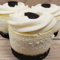 Cookies N' Cream · Creamy vanilla cheesecake with pieces of GF chocolate sandwich cookies inside,  topped with ...