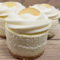 Banana Pudding · Creamy banana cheesecake filled with pieces of banana, topped with our banana buttercream; f...