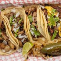 Street Tacos · Served with cilantro and onions.