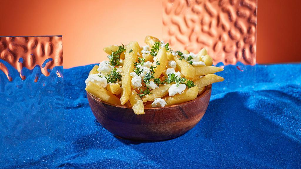 Feta Fries · Fresh cut french fries topped with feta and parsley.