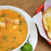 Caldo De Mariscos · Combination of shrimp, catfish, and octopus soup with vegetables.