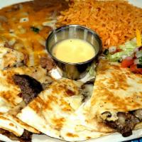 Quesadillas · Quesadilla with choice of beef, chicken fajita, spinach, or plain. Come with rice and beans.