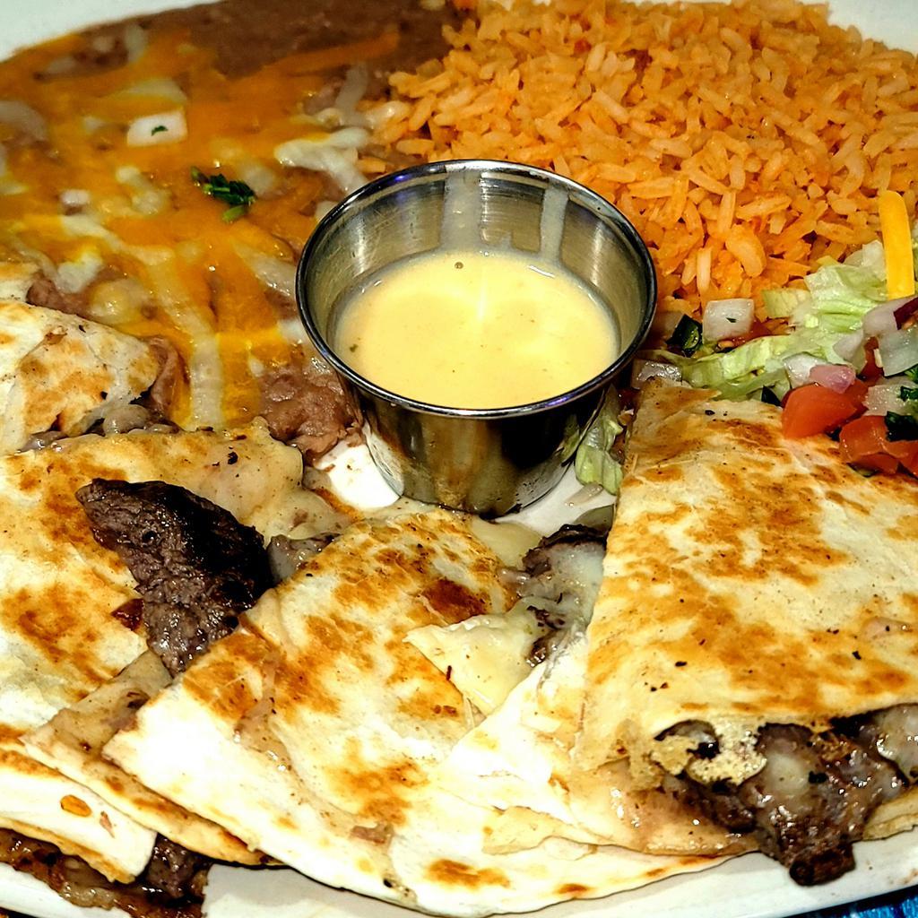 Quesadillas · Quesadilla with choice of beef, chicken fajita, spinach, or plain. Come with rice and beans.