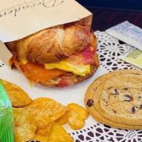 Decadent Lunch Box · Your choice croissant sandwich, freshly baked cookie and kettle chips.