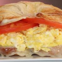 Healthy Wheat Croissant · Scrambled eggs, sliced tomato, and Swiss cheese on a wheat croissant.