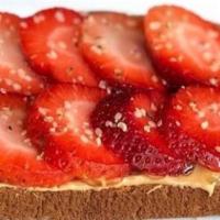 Cashew Butter Toast · Strawberry, agave nectar, and hemp seeds on multigrain toast.