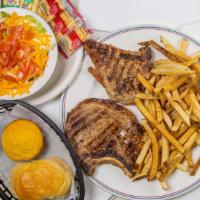 Two Pork Chops · Two grilled or fried pork chops served with your choice of two sides.