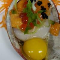 Uni Over Scallop Deluxe · 2 pieces of scallop topped w/ sea urchin, quail egg, salmon caviar, jalapeno, soy tobiko, sc...