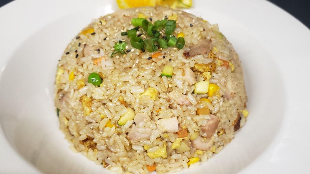 Stir Fried Rice · Stir fried rice w/ vegetables, egg & your choice protein.