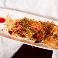 Baked Salmon · 3 crab salad wrapped w/ salmon baked. Topped w/ spicy mayo, eel sauce & leeks.