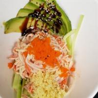 Kani Salad · Shredded crab stick, avocado, cucumber, masago, tempura flakes, sesame seeds, eel sauce & sp...