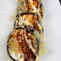 Paradise Roll · Tempura fried roll, spicy crawfish, shrimp fried rice & cream cheese. Topped w/ eel sauce & ...