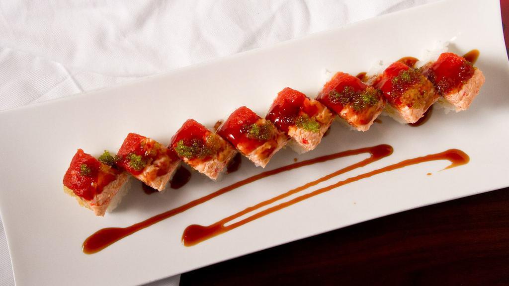 Sushishima Roll · Shrimp tempura & avocado wrapped in soy paper. Topped w/ spicy tuna, snow crab, eel sauce & tobiko.