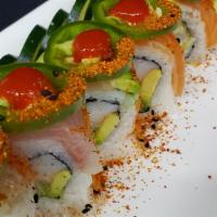 El Toro Roll · Shrimp tempura, crab stick & avocado. Topped w/ salmon, yellowtail, jalapeno slices, srirach...