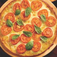 Margherita · Sicilian extra-virgin olive oil, garlic, Wisconsin mozzarella, fresh Roma tomatoes, and fres...