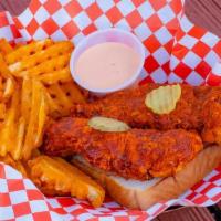 Tender Basket & Waffle Fries · 2 fried chicken tenders (spice level of your choice) with kosher pickles, seasoned waffle fr...