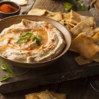 Classic Hummus With Pita Chips (8 Oz.) · A smooth thick mixture of mashed chickpeas, tahini, oil, lemon juice, used especially as a d...