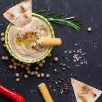 Jalapeño Hummus With Pita Chips (8 Oz.) · This dip is rich and creamy with a fiery finish. Perfect for adding a feisty kick to your ev...