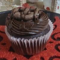 Chocolate Cupcake · Chocolate cupcake topped with mini chocolate pretzel drizzled with chocolate.
