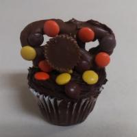 Reese'S Pieces  · Chocolate cupcake, chocolate pretzel with chocolate icing Reese's peanut butter cup sprinkle...
