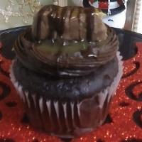 Snickers Cupcake · Chocolate cupcake topped with chocolate icing , snickers candy bar ,topped with peanuts, dri...