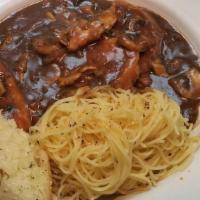 Chicken Marsala · Sautéed chicken, mushrooms, and diced tomatoes smothered in Marsala wine sauce. Served over ...
