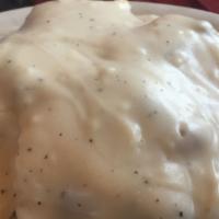 Oven Fresh Biscuits & Gravy · Two buttermilk biscuits smothered in country style peppered gravy.