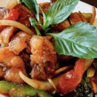 Basil Salmon · Grilled salmon stir fried in a spicy basil sauce topped with basil, bell peppers, young pepp...